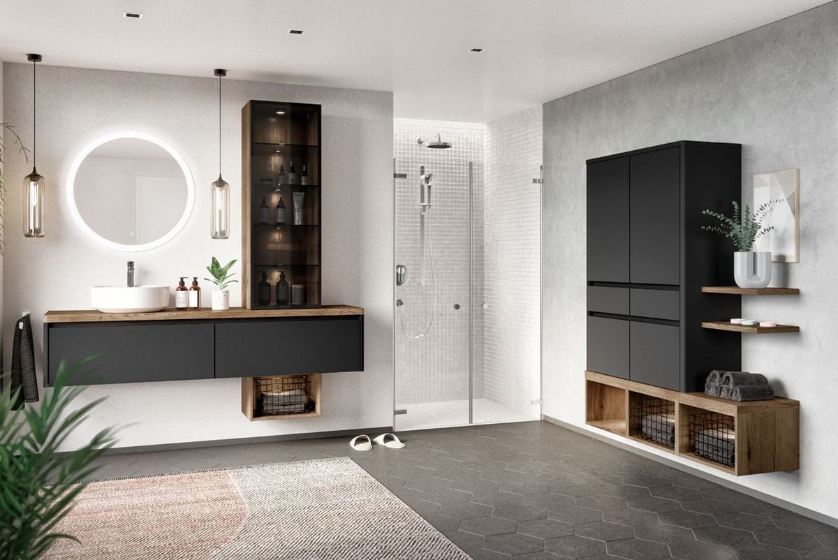 Salle de bain minérale avec miroir rond, colonne vitrée et douche